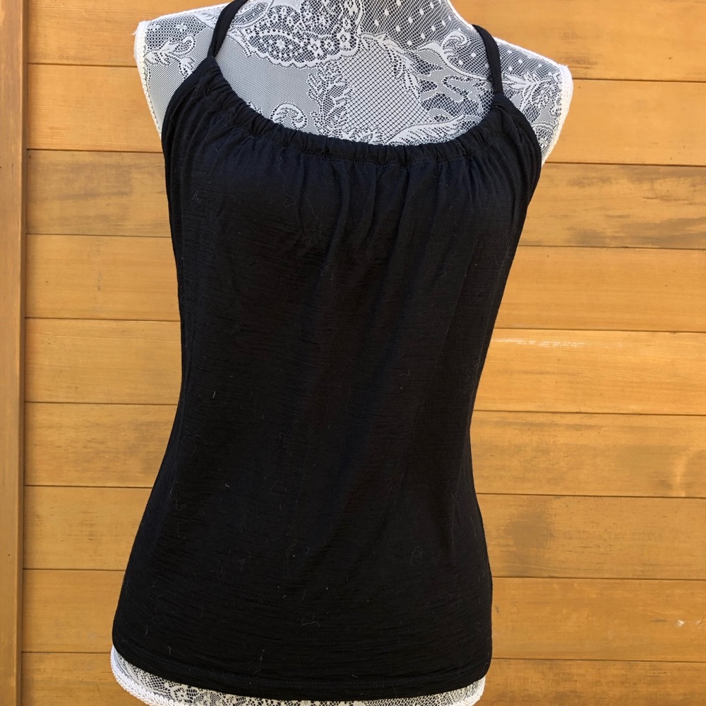 Icebreaker tank top with shelf bra. Minor damage where I overstretched it.